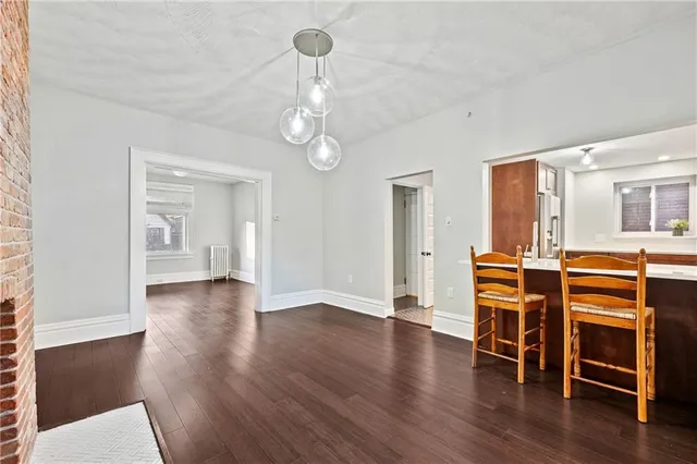 a view of a livingroom with furniture wooden floor and window