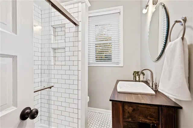 a bathroom with a sink a vanity and a mirror