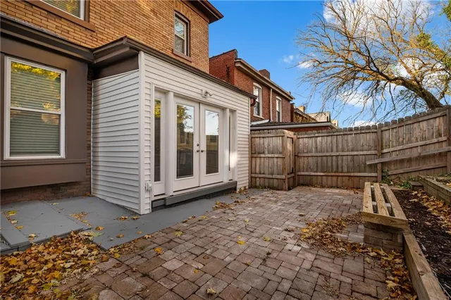 a view of empty room with wooden ceiling