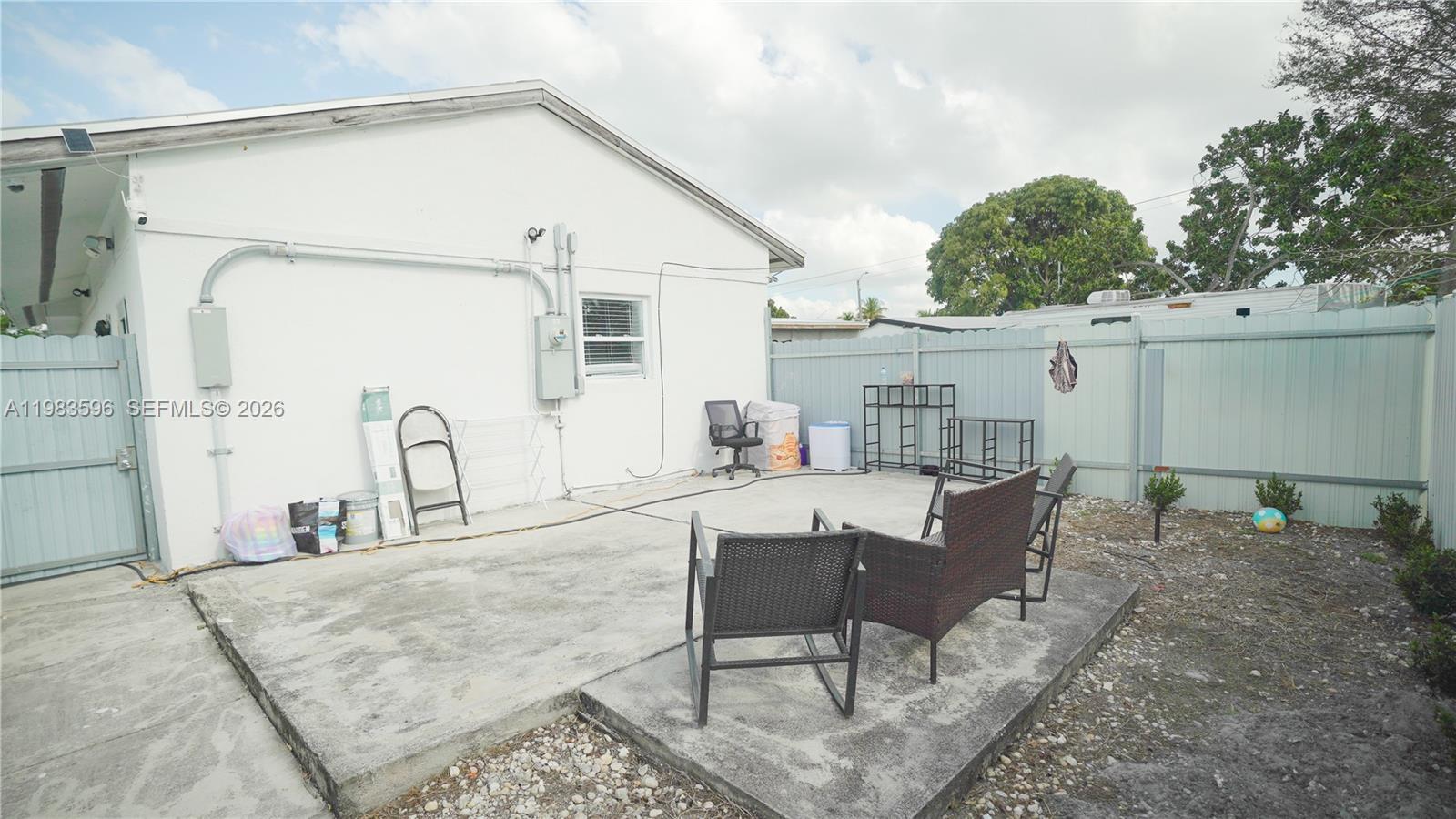 1720 Northwest 124th Terrace Miami, FL 33167 - Photo 23 of 73 a view of a house with backyard and sitting area