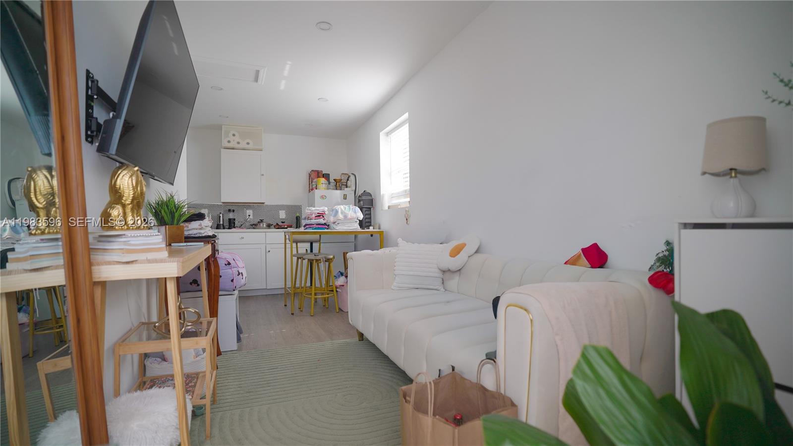 1720 Northwest 124th Terrace Miami, FL 33167 - Photo 26 of 73 a living room with furniture and a table