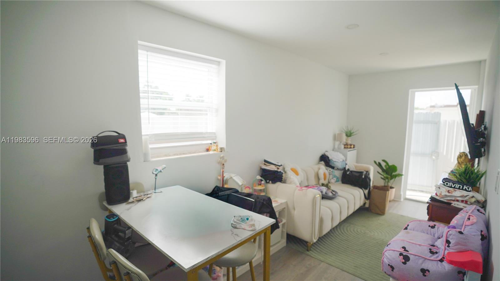 1720 Northwest 124th Terrace Miami, FL 33167 - Photo 28 of 73 a bedroom with a bed and a window