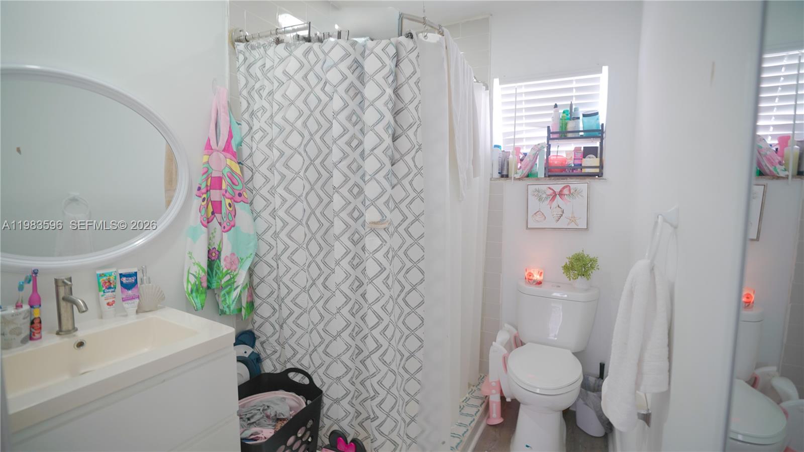 1720 Northwest 124th Terrace Miami, FL 33167 - Photo 30 of 73 a bathroom with a sink toilet and shower