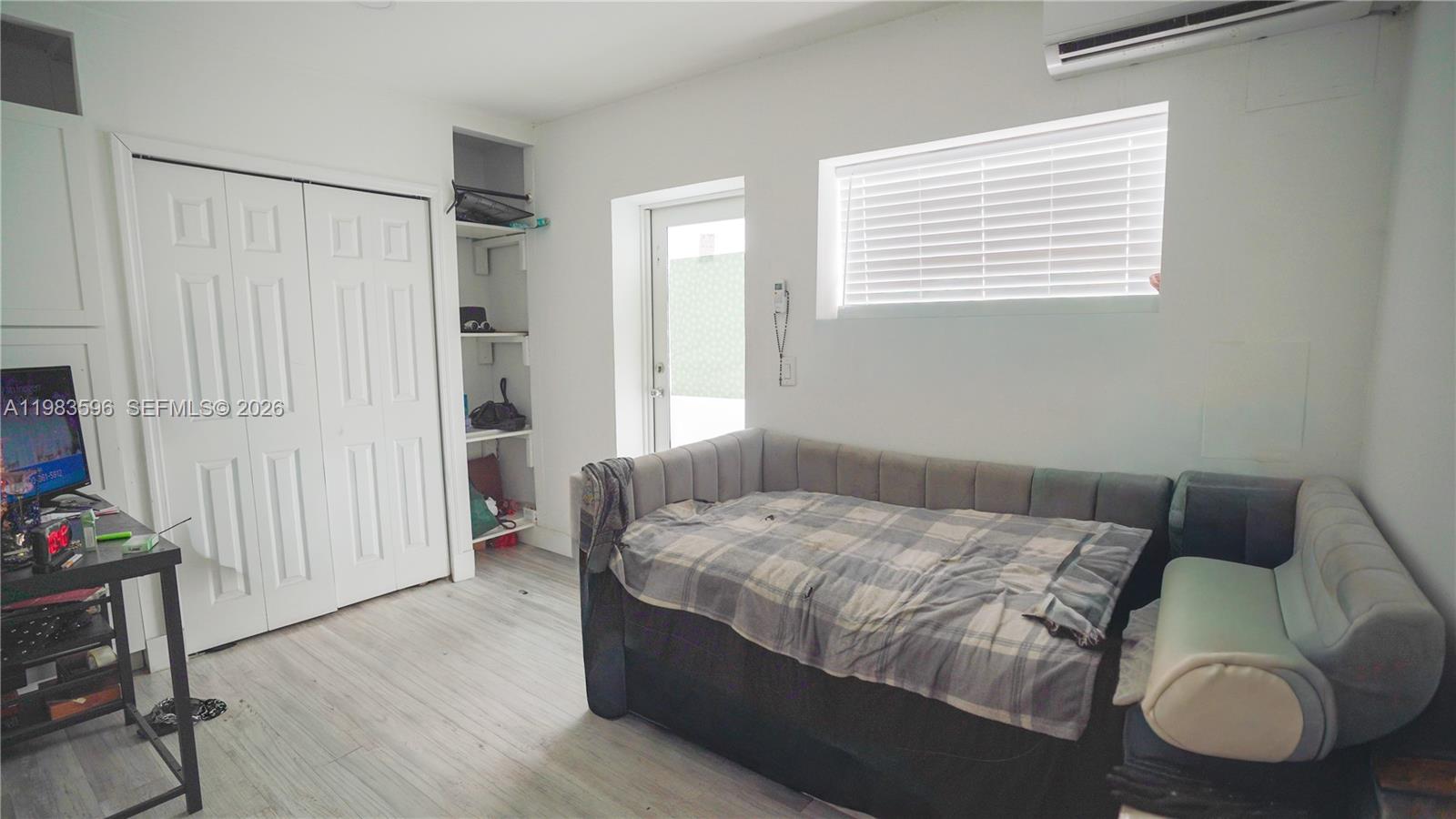 1720 Northwest 124th Terrace Miami, FL 33167 - Photo 41 of 73 a bedroom with a bed and a window