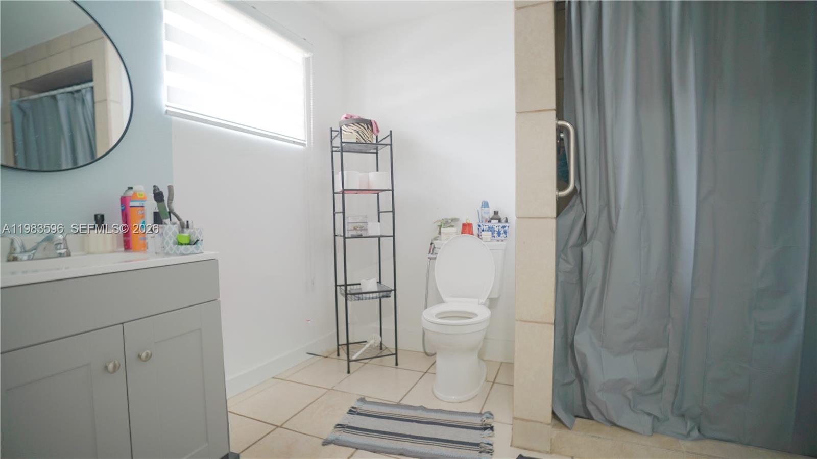 1720 Northwest 124th Terrace Miami, FL 33167 - Photo 43 of 73 a bathroom with a toilet and a sink