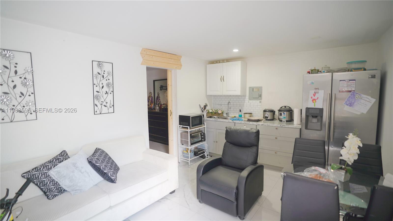 1720 Northwest 124th Terrace Miami, FL 33167 - Photo 47 of 73 a living room with furniture and a couch