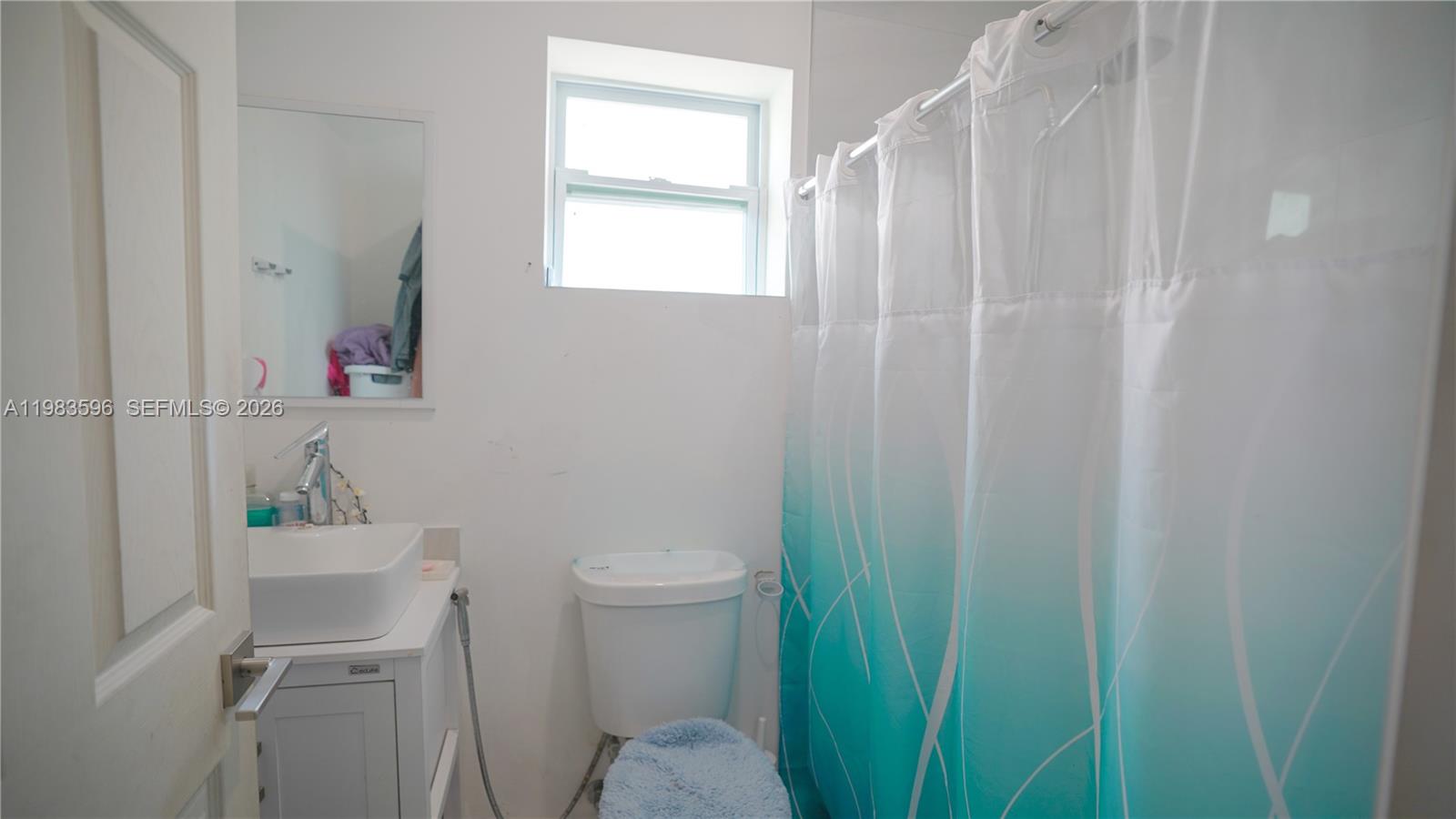 1720 Northwest 124th Terrace Miami, FL 33167 - Photo 50 of 73 a bathroom with a sink toilet and vanity
