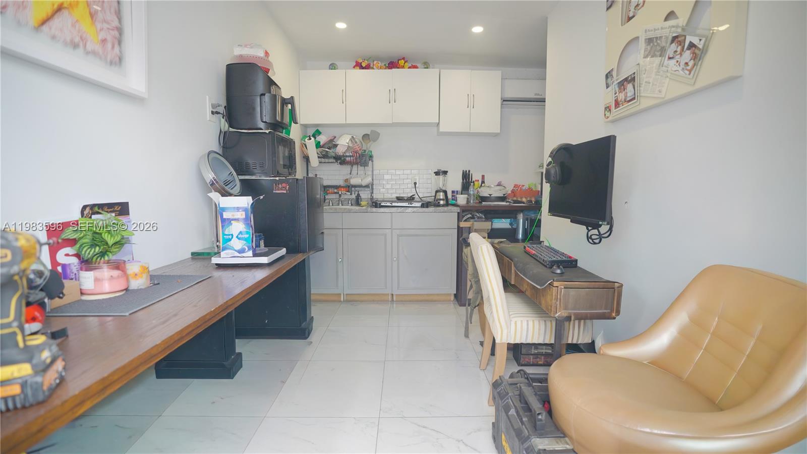 1720 Northwest 124th Terrace Miami, FL 33167 - Photo 51 of 73 a kitchen with a sink and cabinets