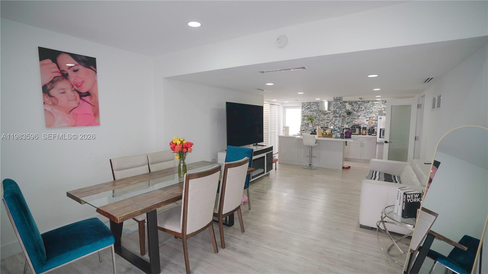 1720 Northwest 124th Terrace Miami, FL 33167 - Photo 58 of 73 a view of a dining room with furniture and a kitchen