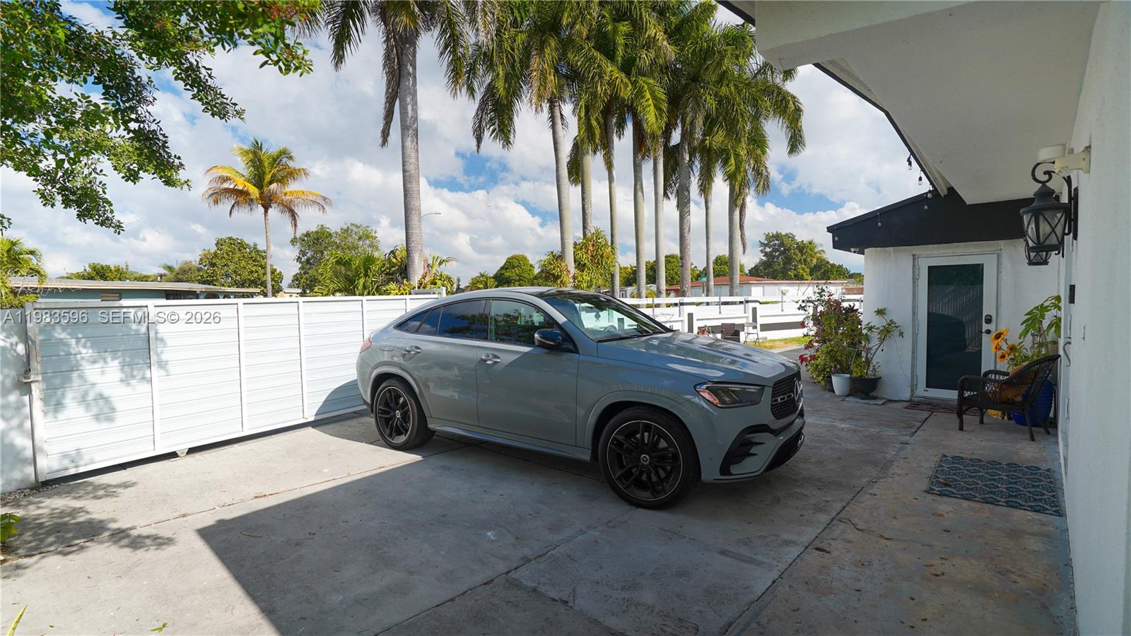 1720 Northwest 124th Terrace Miami, FL 33167 - Photo 6 of 73 a car parked in front of a house