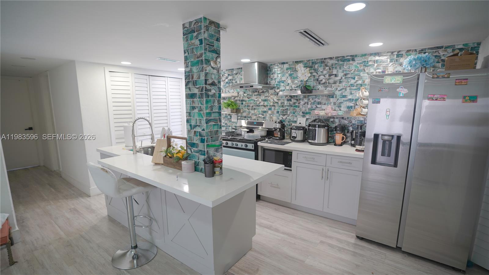 1720 Northwest 124th Terrace Miami, FL 33167 - Photo 62 of 73 a kitchen with refrigerator and sink