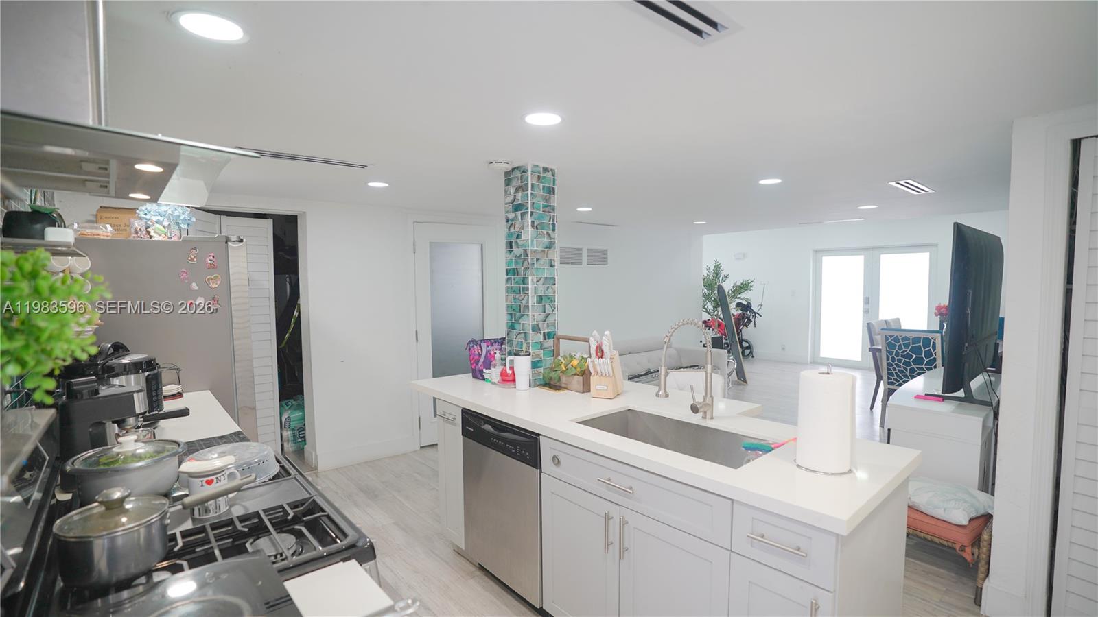 1720 Northwest 124th Terrace Miami, FL 33167 - Photo 63 of 73 a bathroom with a sink and a mirror