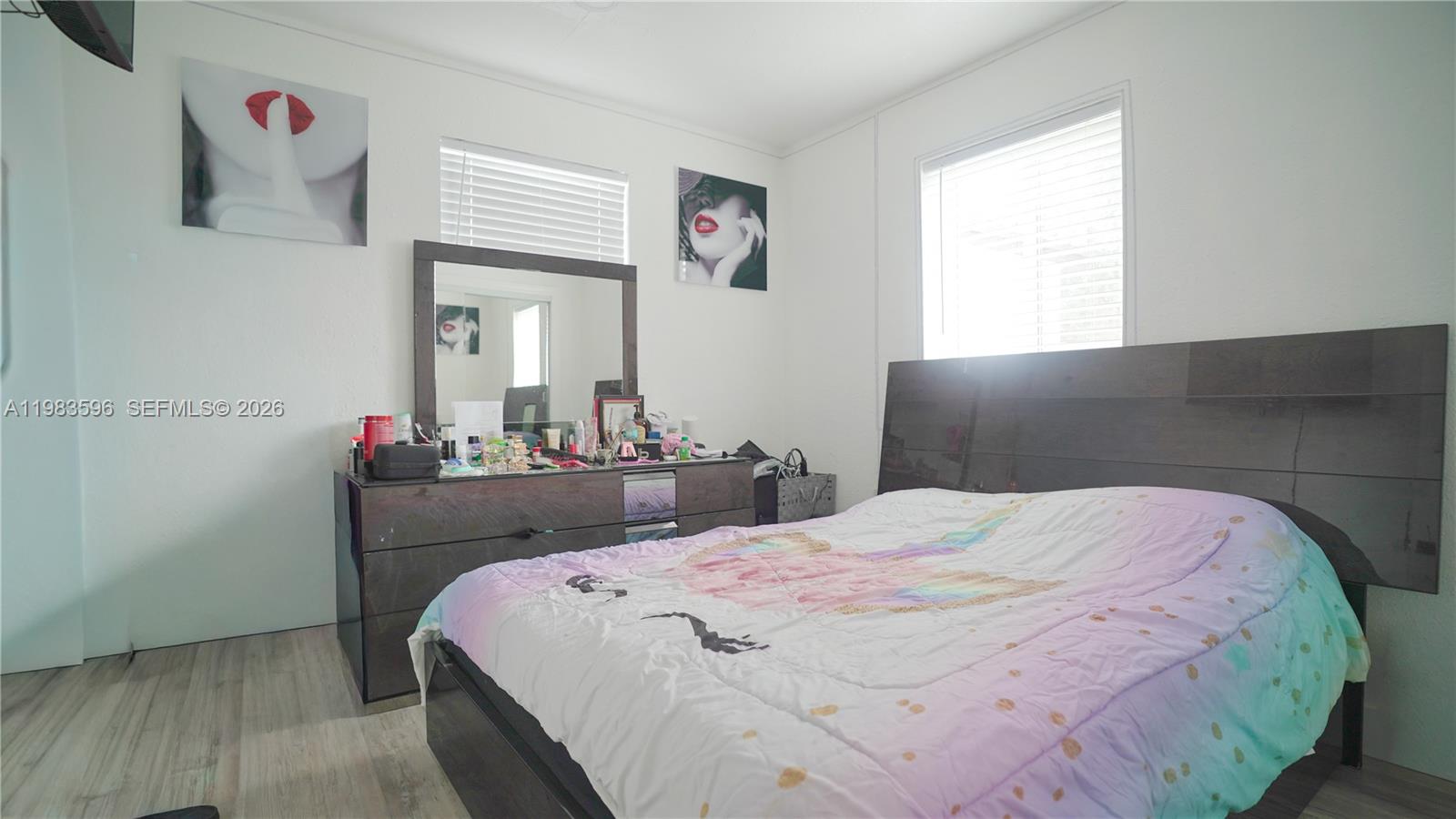 1720 Northwest 124th Terrace Miami, FL 33167 - Photo 67 of 73 a bedroom with a bed and a dresser