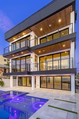 a view of a swimming pool with an outdoor space and seating area