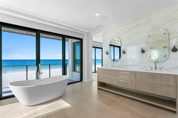 a bathroom with a sink mirror toilet and shower