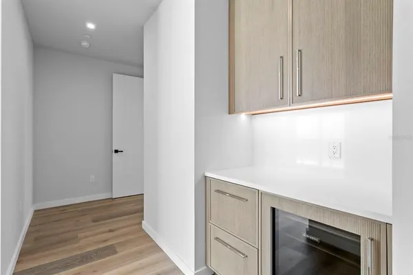 a spacious bathroom with a double vanity sink and a tub
