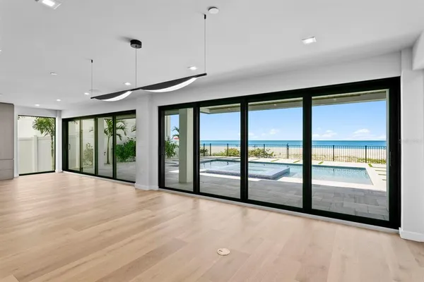 a view of a hallway with wooden floor and a sink