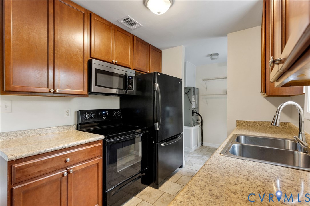164 Kinneytown Road Mineral, VA 23117 - Photo 12 of 31 a kitchen with a sink stove and refrigerator