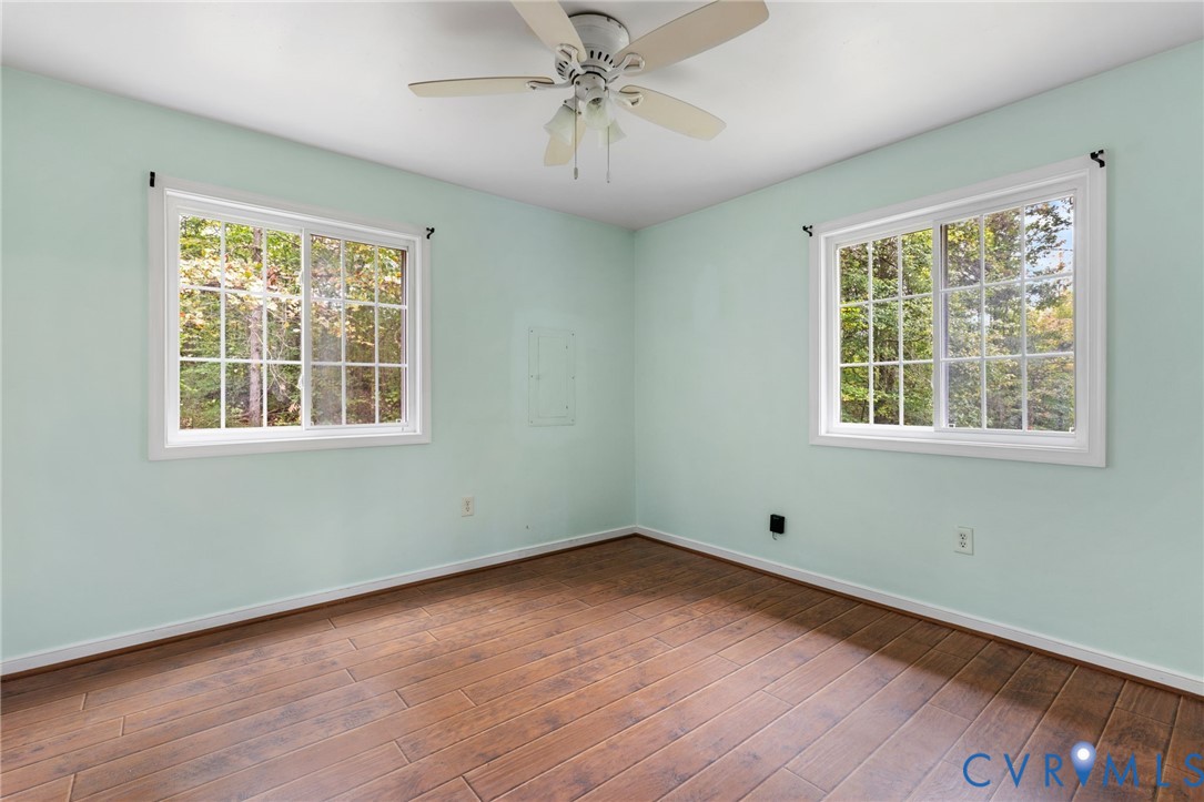164 Kinneytown Road Mineral, VA 23117 - Photo 21 of 31 a view of empty room with window and wooden floor