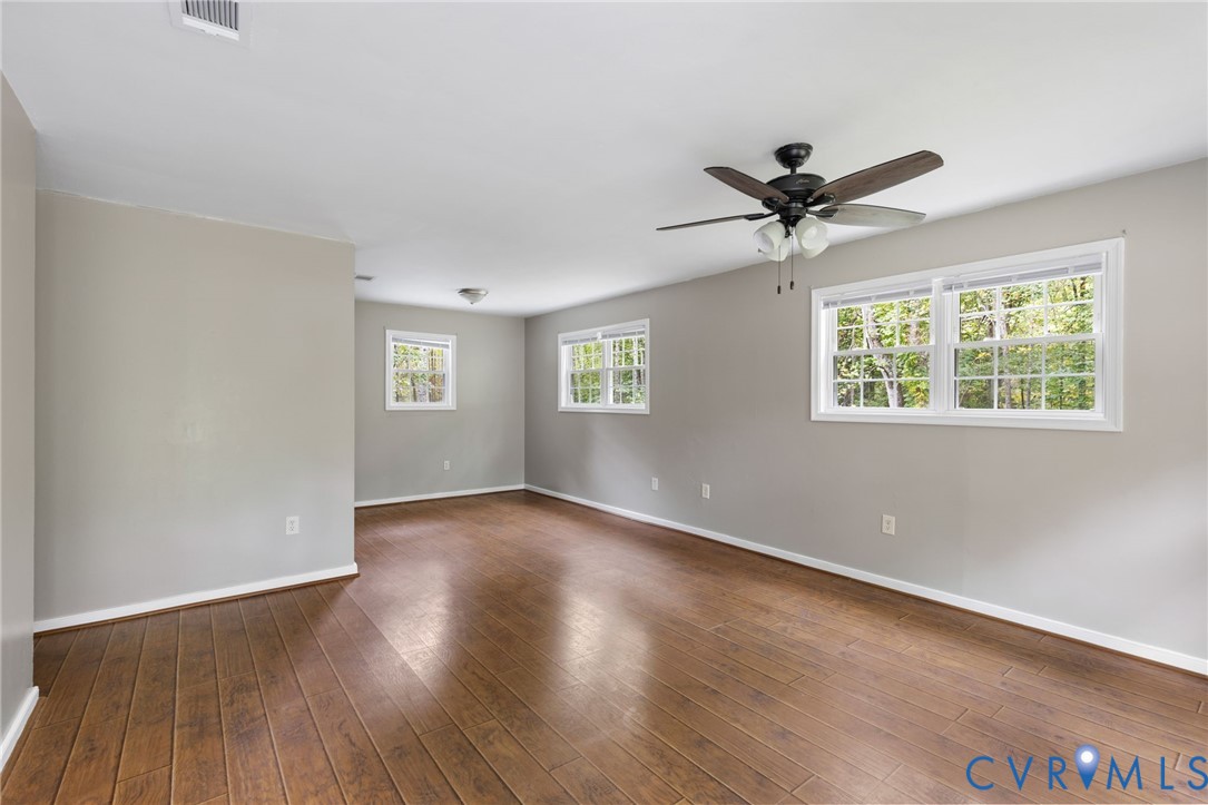 164 Kinneytown Road Mineral, VA 23117 - Photo 4 of 31 wooden floor in an empty room with a window