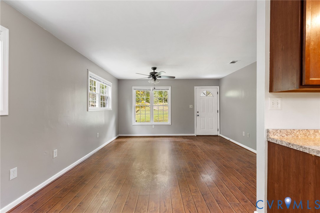 164 Kinneytown Road Mineral, VA 23117 - Photo 8 of 31 an empty room with wooden floor and windows