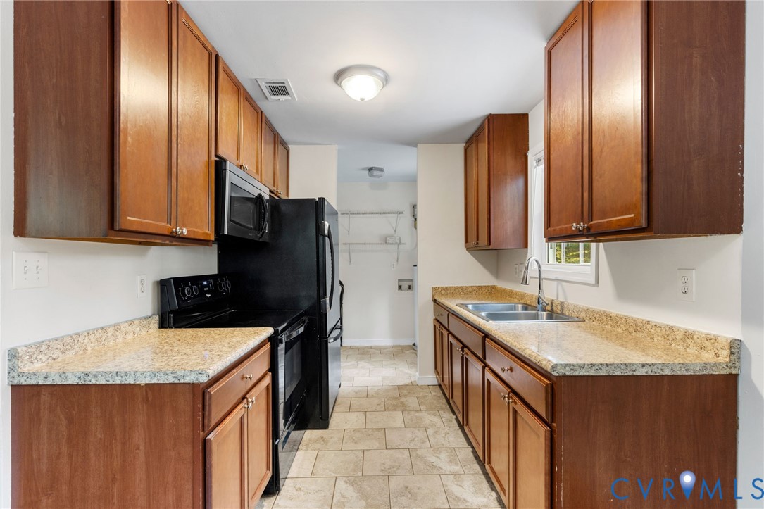 164 Kinneytown Road Mineral, VA 23117 - Photo 10 of 31 a kitchen with a sink a stove and a refrigerator