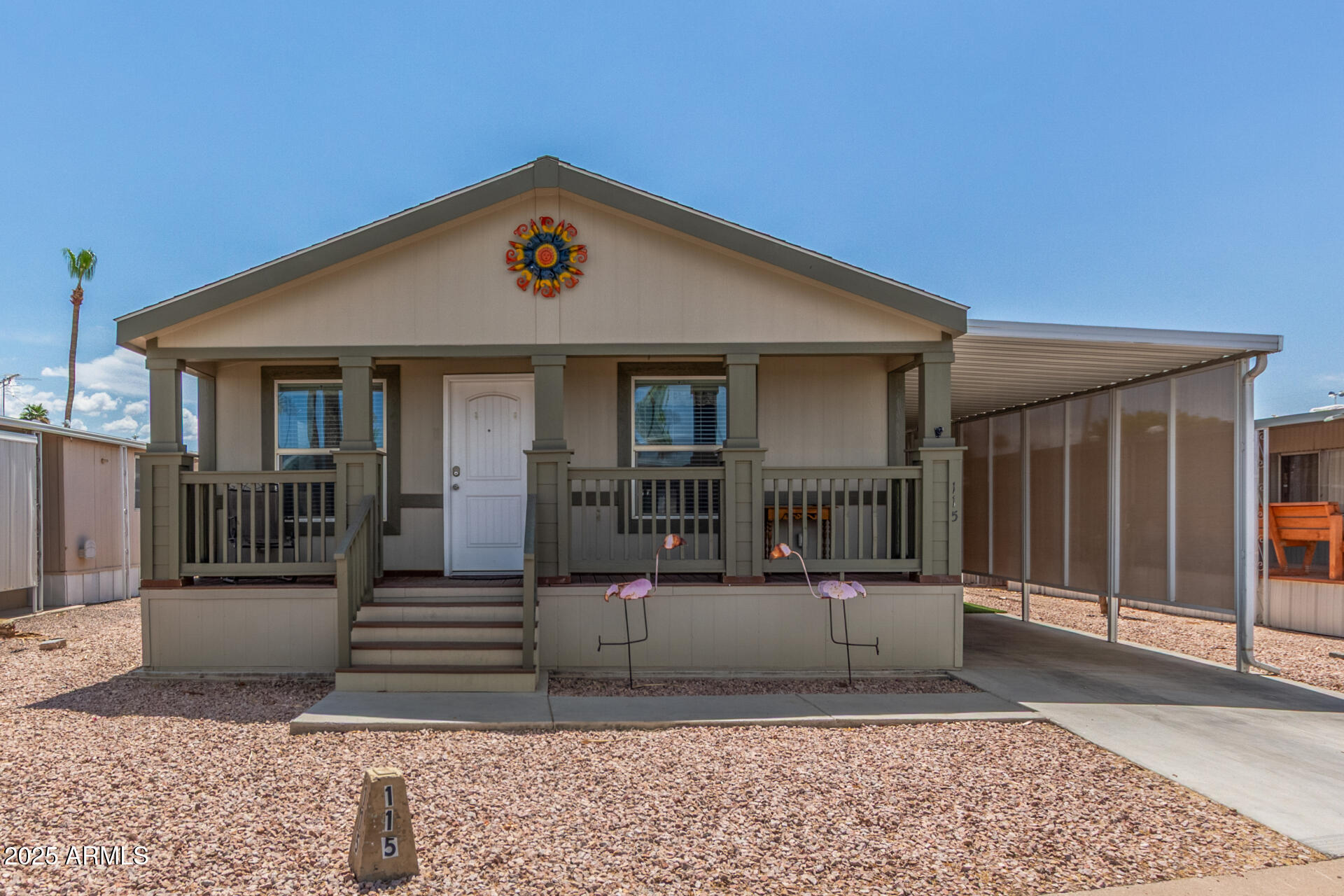 11425 East University Drive, Unit 115 Apache Junction, AZ 85120 - Photo 1 of 28 a view of a house with wooden fence