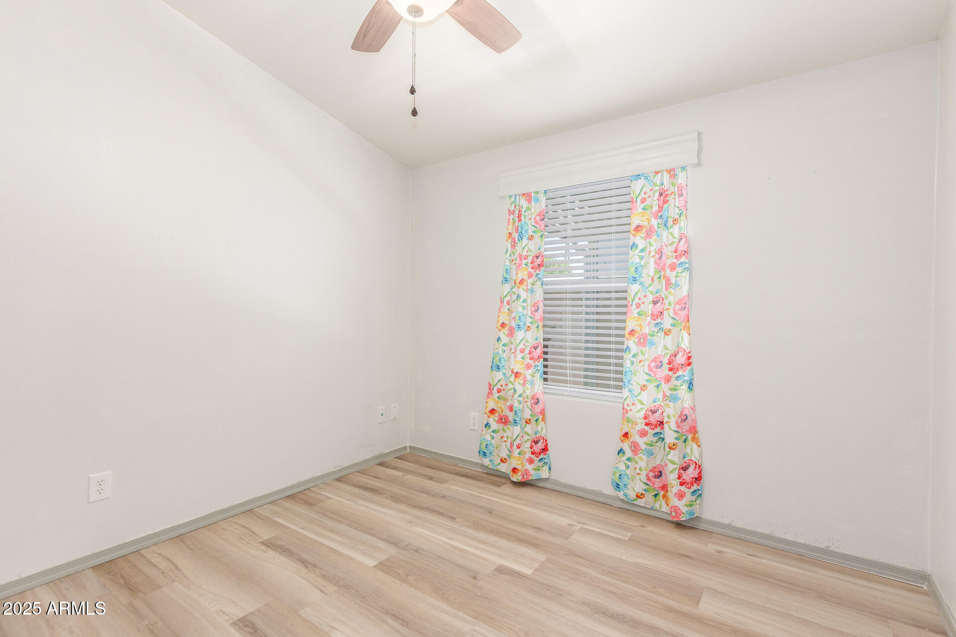 11425 East University Drive, Unit 115 Apache Junction, AZ 85120 - Photo 15 of 28 an empty room with cabinet and windows