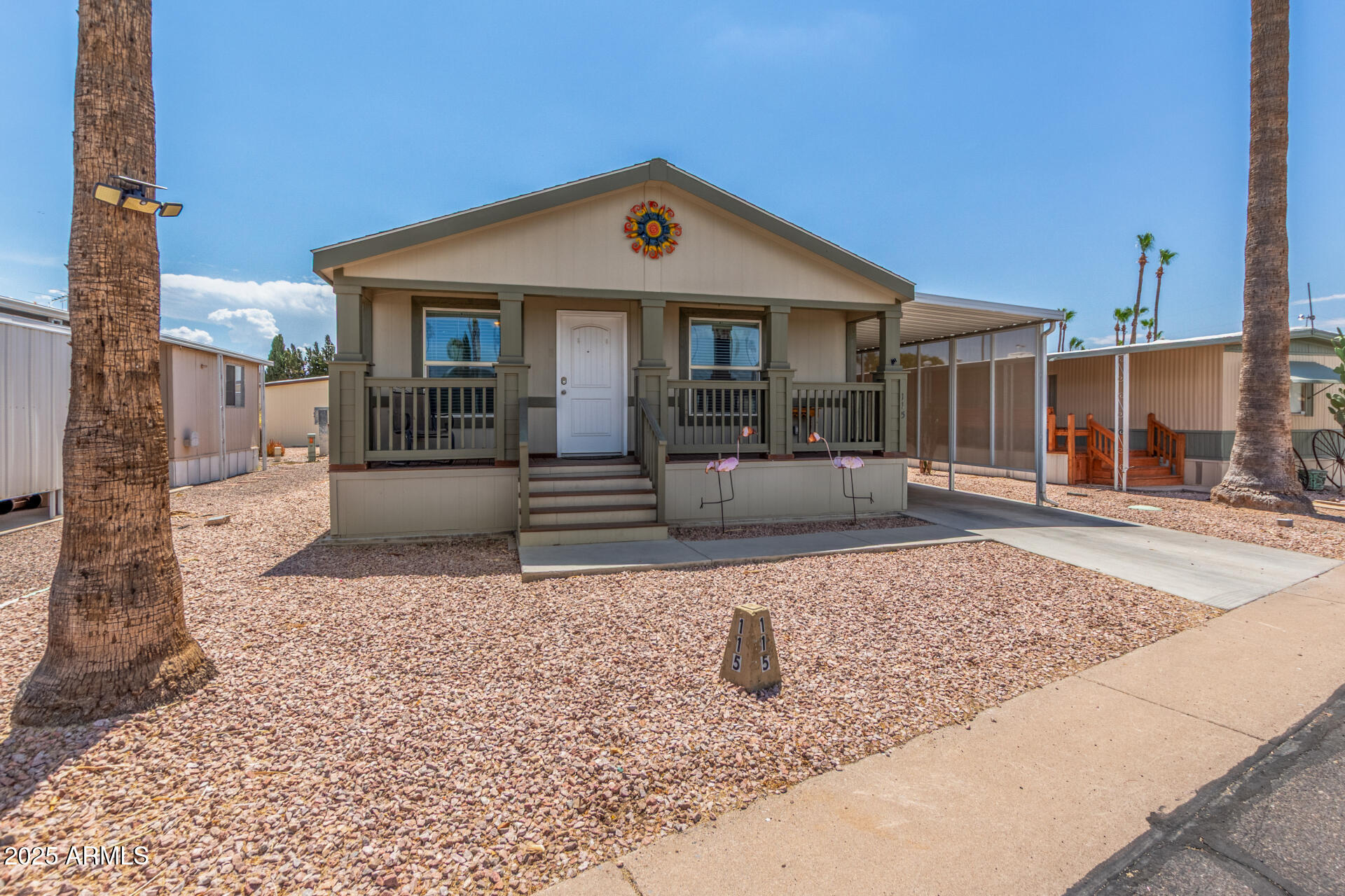 11425 East University Drive, Unit 115 Apache Junction, AZ 85120 - Photo 18 of 28 a front view of a house with garden