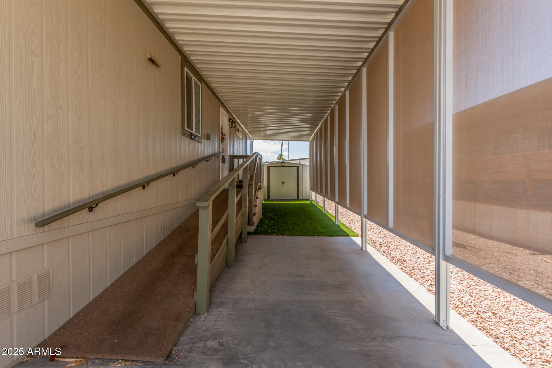 11425 East University Drive, Unit 115 Apache Junction, AZ 85120 - Photo 20 of 28 a view of a pathway of a house with wooden floor