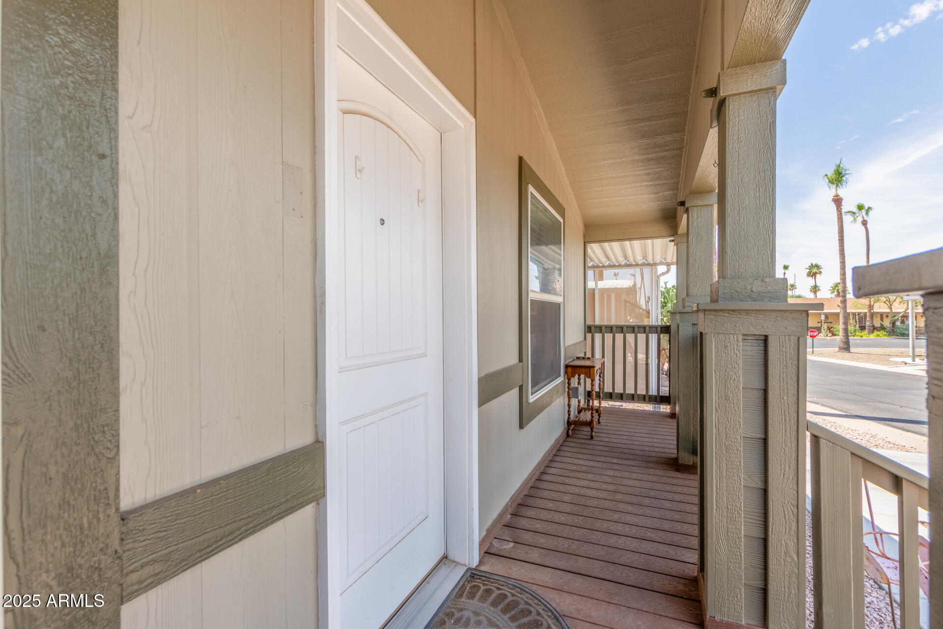 11425 East University Drive, Unit 115 Apache Junction, AZ 85120 - Photo 2 of 28 a view of a hallway with wooden floor and staircase