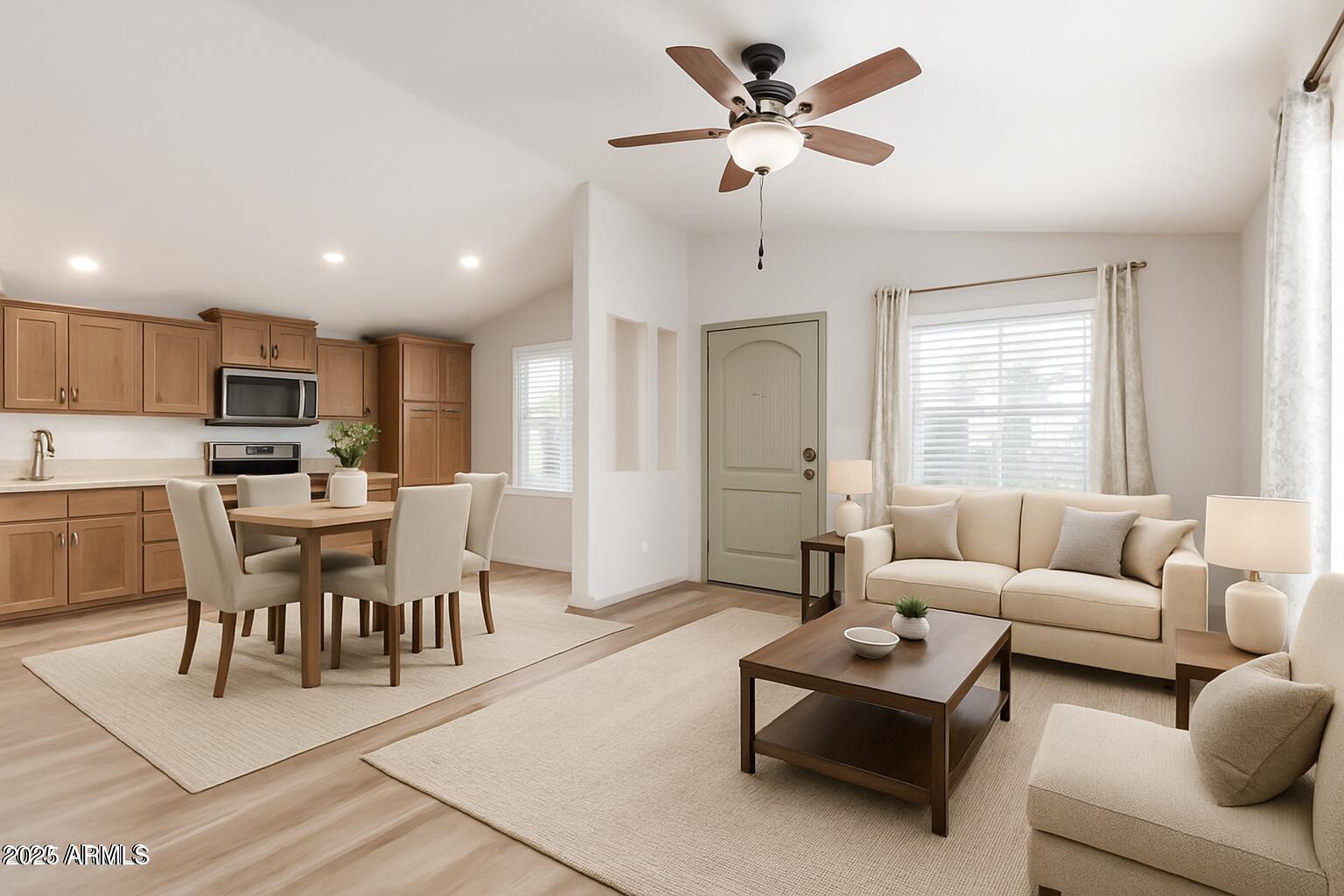 11425 East University Drive, Unit 115 Apache Junction, AZ 85120 - Photo 3 of 28 a living room with furniture kitchen view and a window