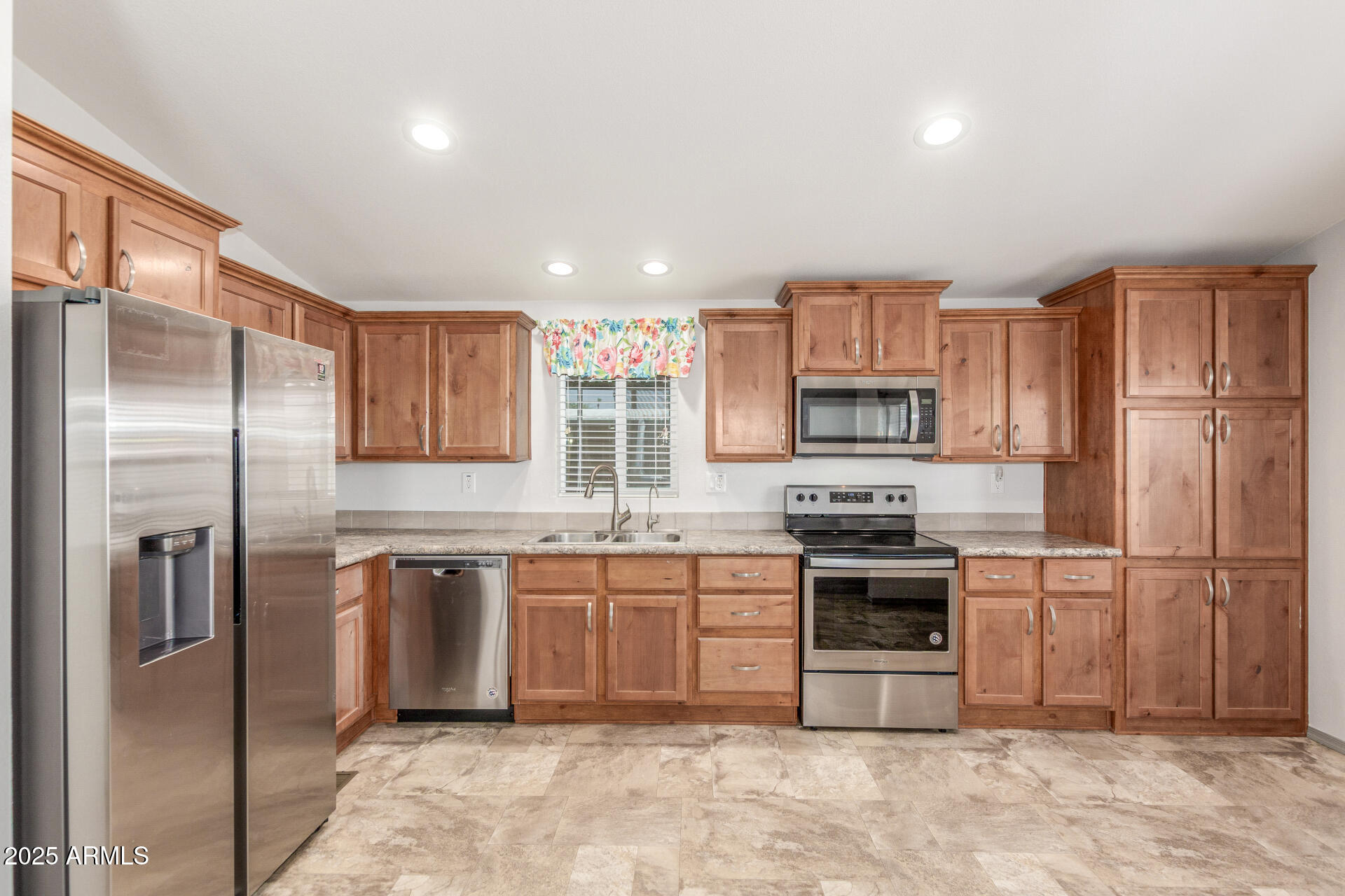 11425 East University Drive, Unit 115 Apache Junction, AZ 85120 - Photo 5 of 28 a kitchen with stainless steel appliances granite countertop a refrigerator stove a sink and a microwave