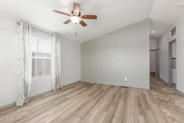 a kitchen with stainless steel appliances granite countertop a refrigerator stove top oven and sink