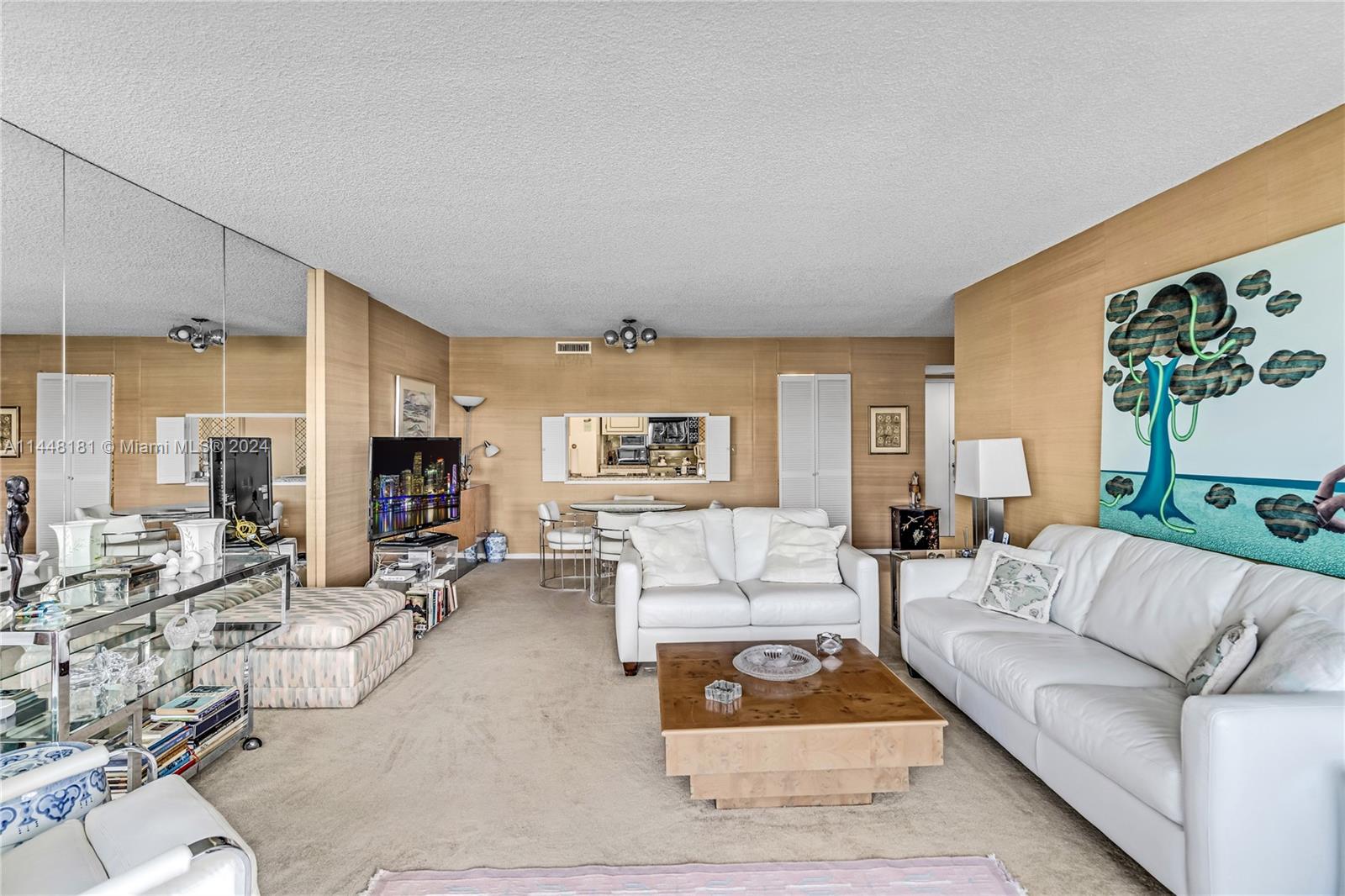 199 Ocean Ln Drive, Unit 212 Key Biscayne, FL 33149 - Photo 11 of 44 a living room with furniture a large window and a table