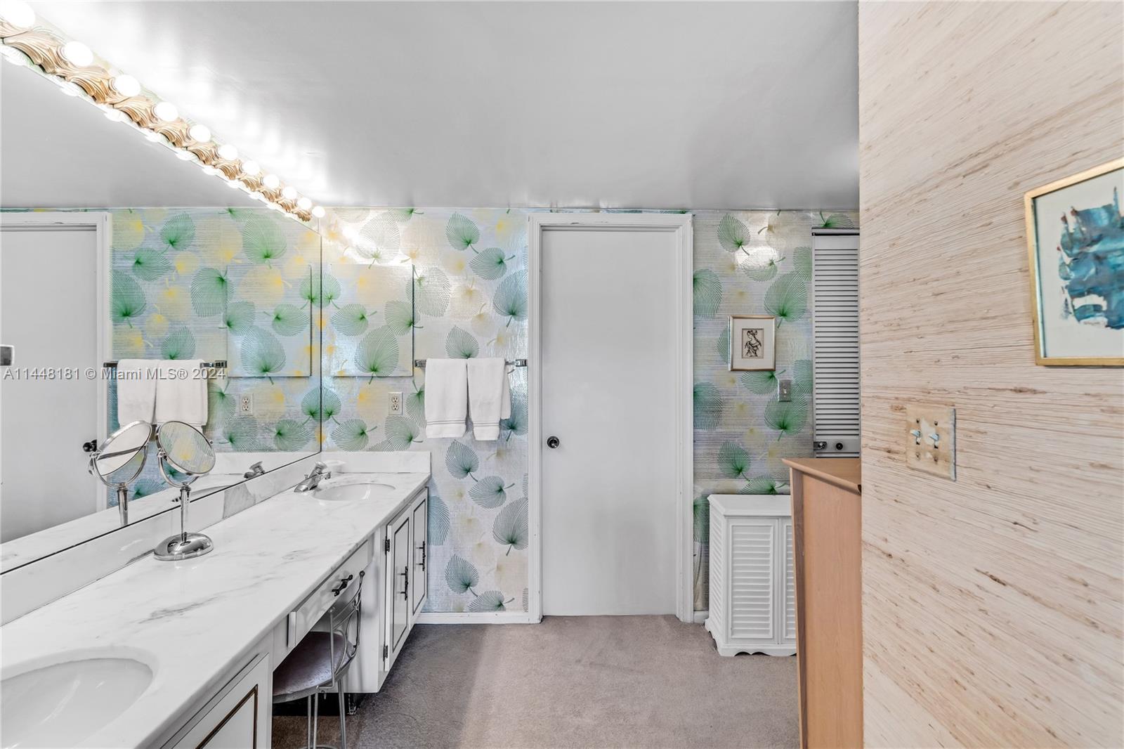 199 Ocean Ln Drive, Unit 212 Key Biscayne, FL 33149 - Photo 18 of 44 a spacious bathroom with a double vanity sink a mirror and shower