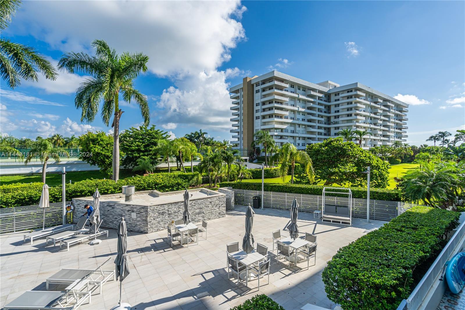 199 Ocean Ln Drive, Unit 212 Key Biscayne, FL 33149 - Photo 2 of 44 a view of a chairs and table in the patio