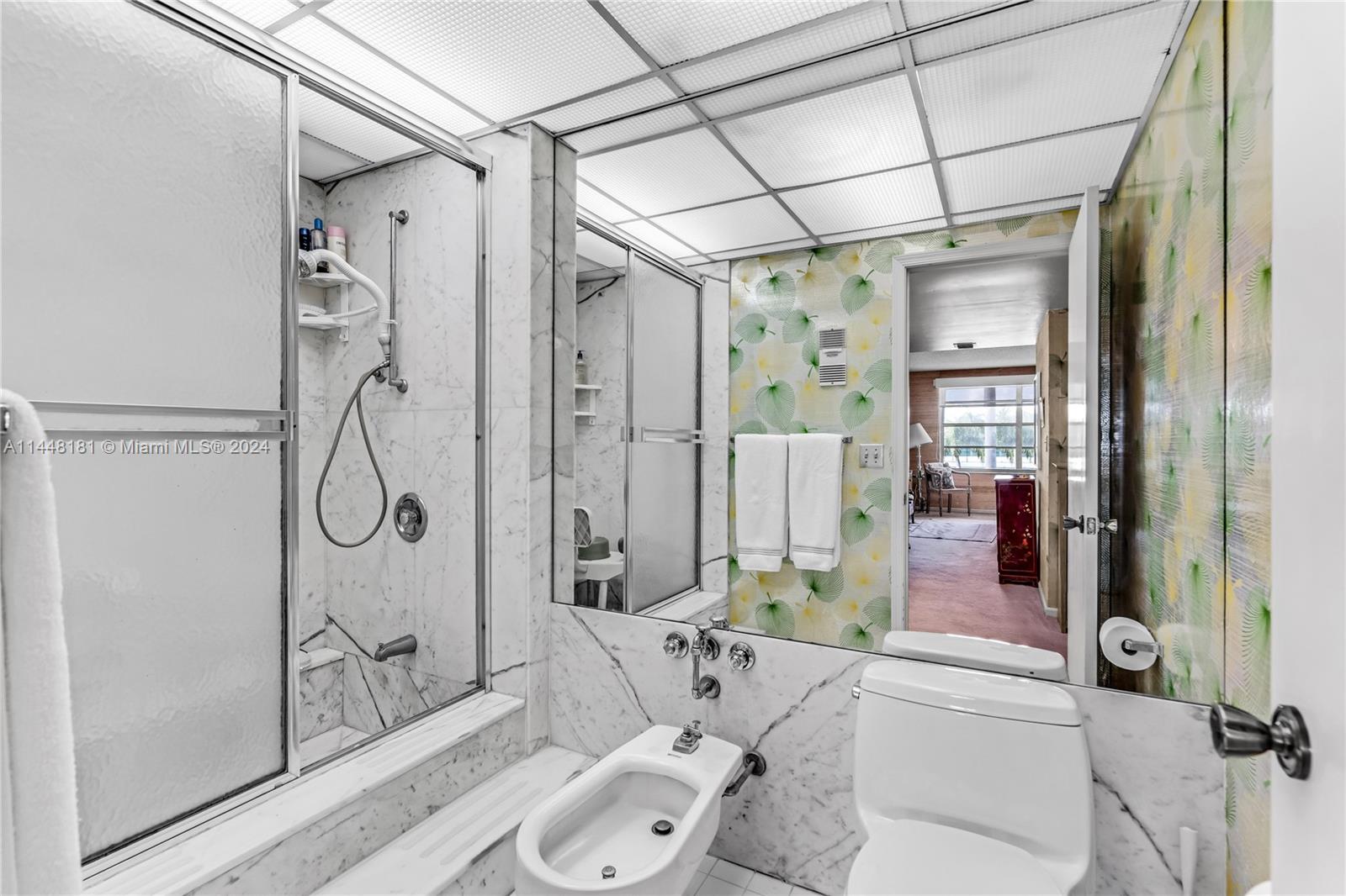 199 Ocean Ln Drive, Unit 212 Key Biscayne, FL 33149 - Photo 21 of 44 a bathroom with a granite countertop sink a toilet and shower