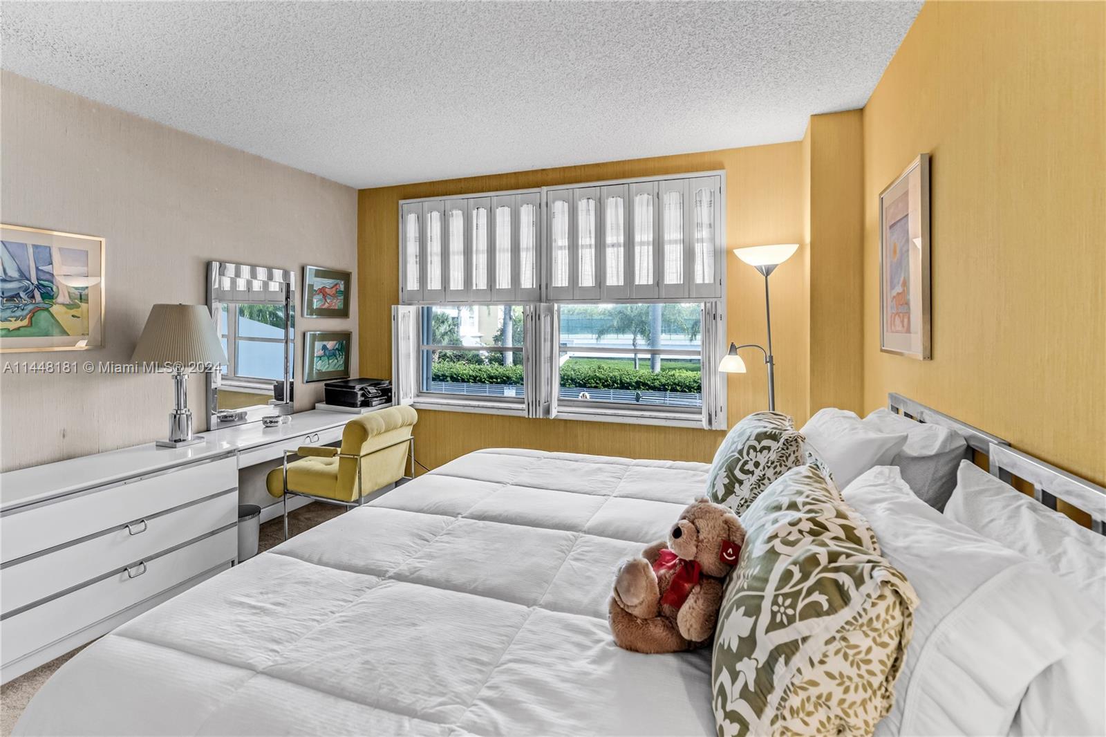 199 Ocean Ln Drive, Unit 212 Key Biscayne, FL 33149 - Photo 23 of 44 a bedroom with a large bed and a large window
