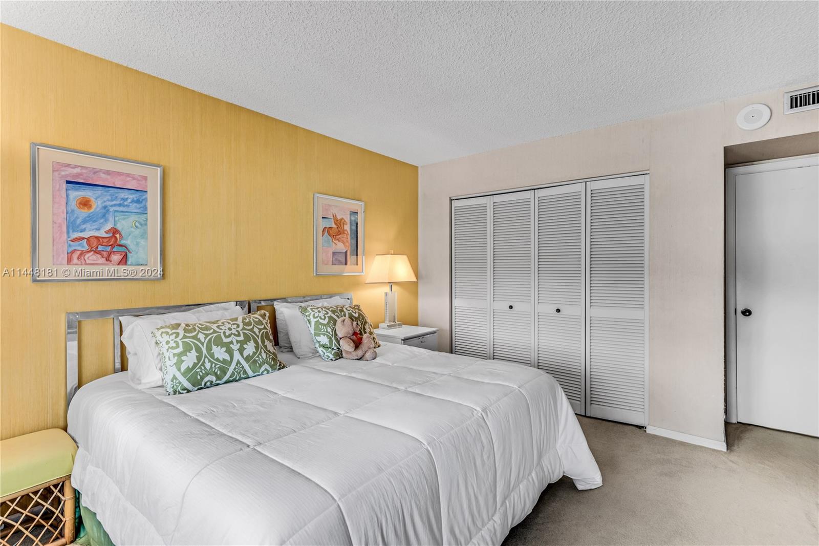 199 Ocean Ln Drive, Unit 212 Key Biscayne, FL 33149 - Photo 24 of 44 a bedroom with a bed and a painting on the wall