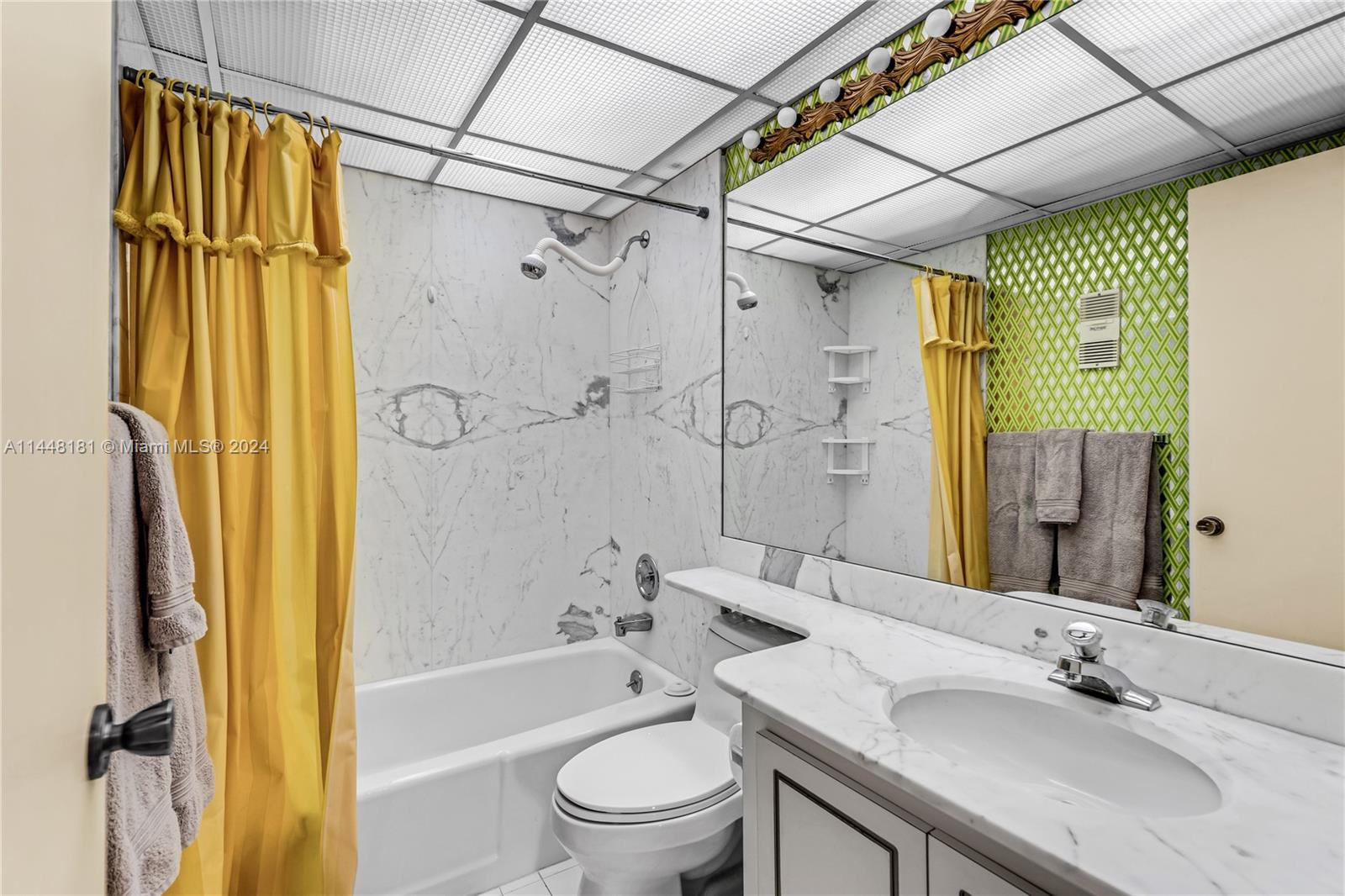 199 Ocean Ln Drive, Unit 212 Key Biscayne, FL 33149 - Photo 25 of 44 a bathroom with a sink shower bathtub and a toilet