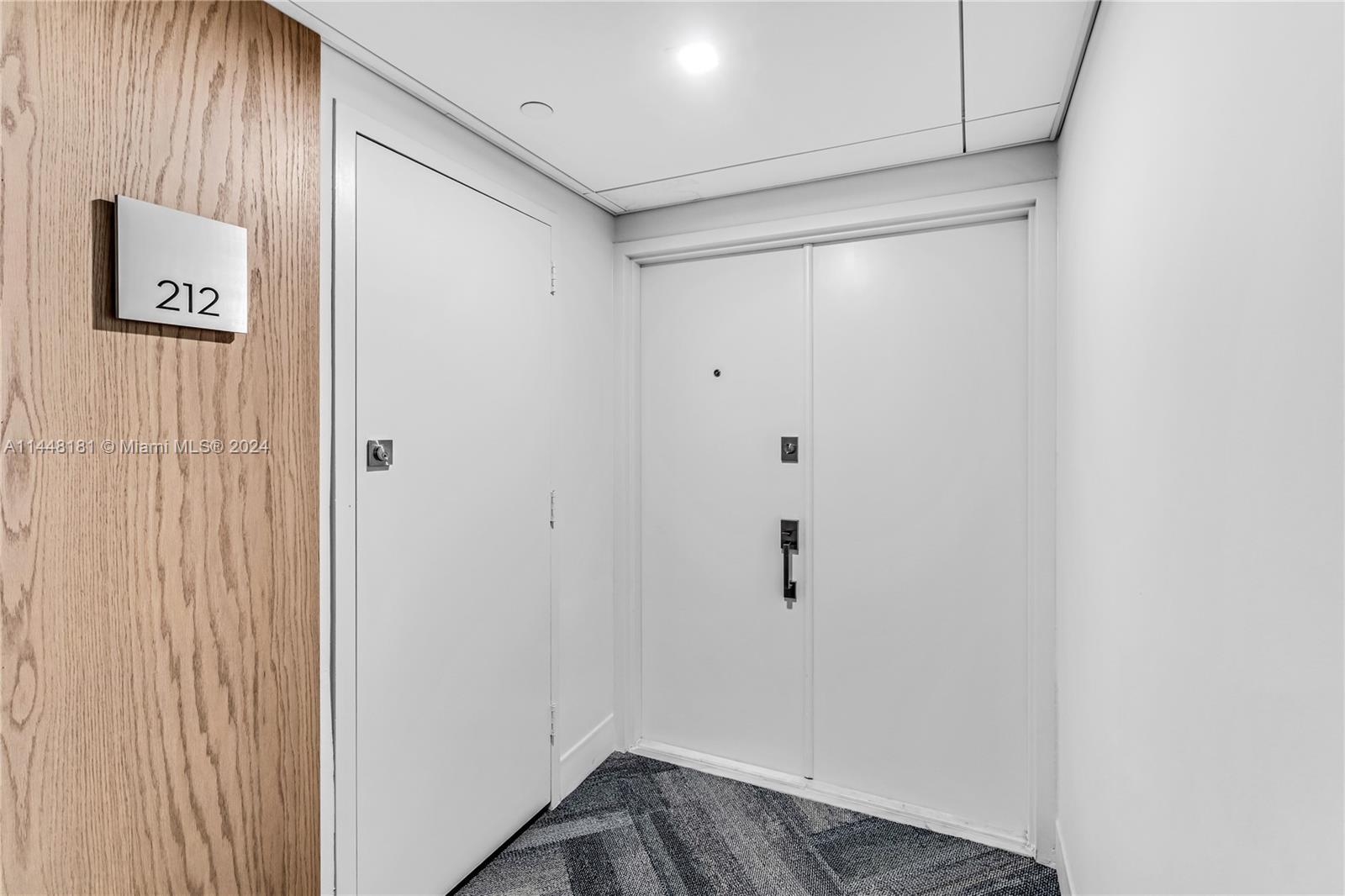 199 Ocean Ln Drive, Unit 212 Key Biscayne, FL 33149 - Photo 4 of 44 a view of hallway with wooden floor