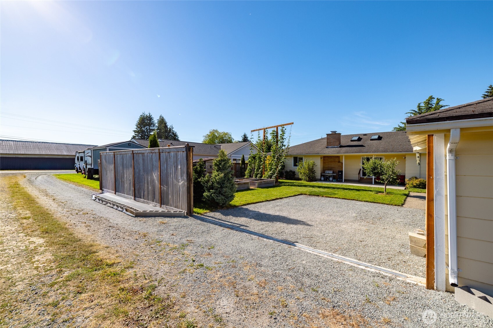 415 Sterling Street Sedro-Woolley, WA 98284 - Photo 26 of 38 a view of a house with a swimming pool