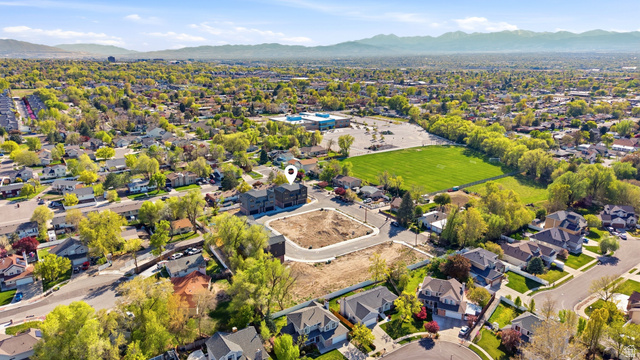 330 East 7635 S Street Sandy, UT 84047 - Photo 27 of 29 Aerial perspective of suburban area featuring a mountainous background