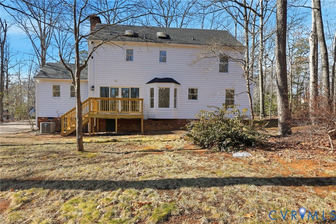 3264 Sherwood Ridge Way Powhatan, VA 23139 - Photo 36 of 40 a front view of a house with large trees