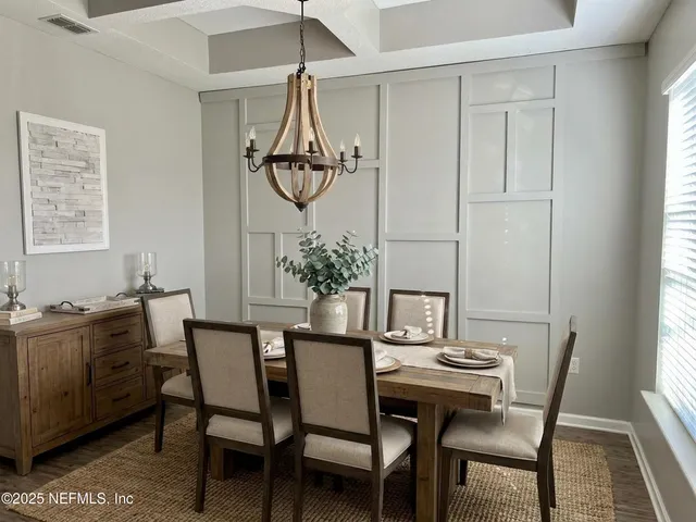 a kitchen with kitchen island stainless steel appliances a sink and refrigerator