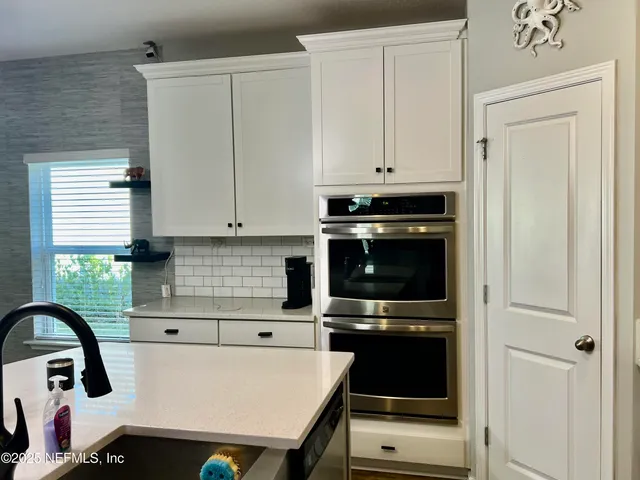 a bathroom with a shower and a sink