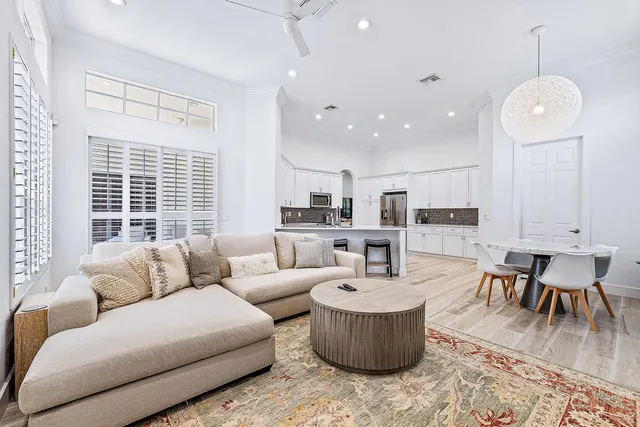 a bathroom with a sink a toilet a mirror and shower curtain