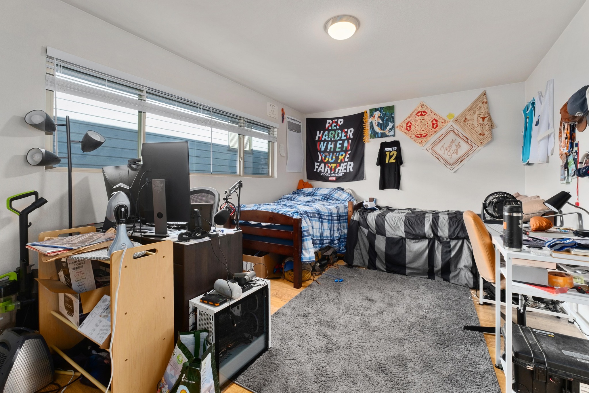 2404 Longview Street, Unit 105 Austin, TX 78705 - Photo 4 of 21 a bedroom with furniture and a window
