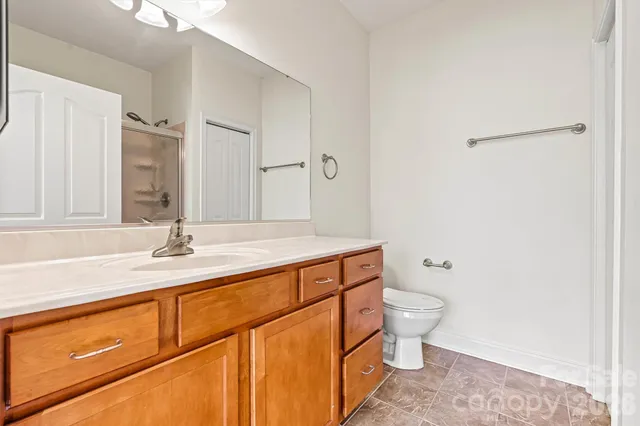 a bathroom with a sink toilet and vanity